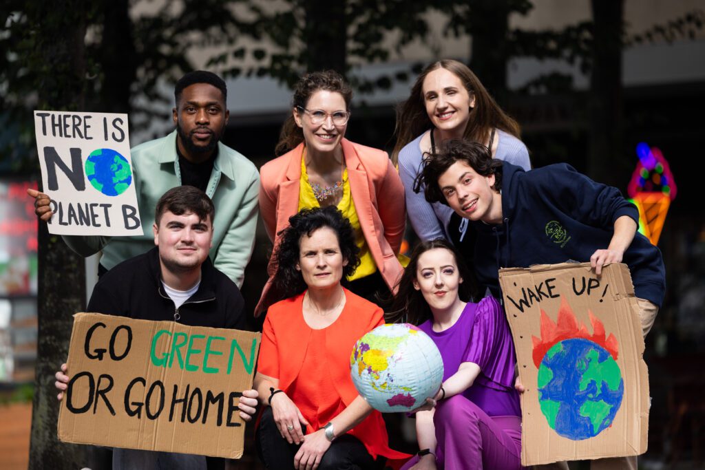 A group of youth ambassadors holding protest signs calling for climate action. A file photo from International youth day.