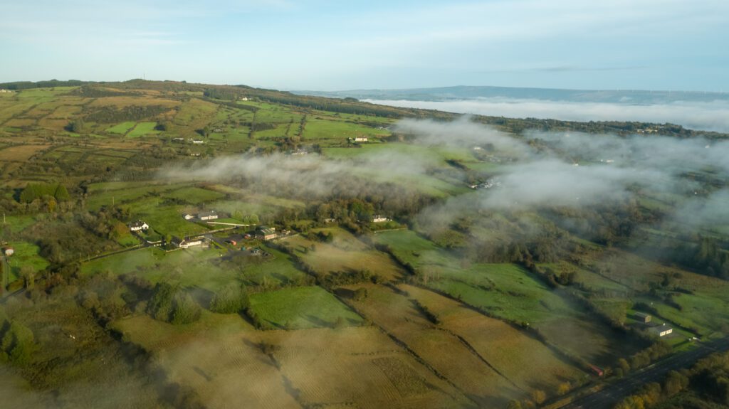 Aerial photo through light clouds of Irish countryside in Boyle, County Roscommon.
